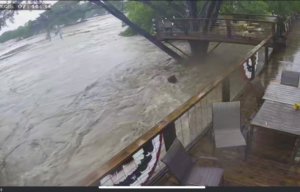 A still image from video footage of the rising floodwaters in Kerrville, Texas.