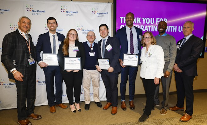 Members of the team who helped save the patient’s life that night were honored with an award by their hospital. Caitlin Eyerman is third from left.