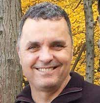 Headshot of John Maye