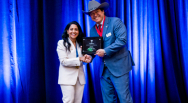 Image of 2 members with award